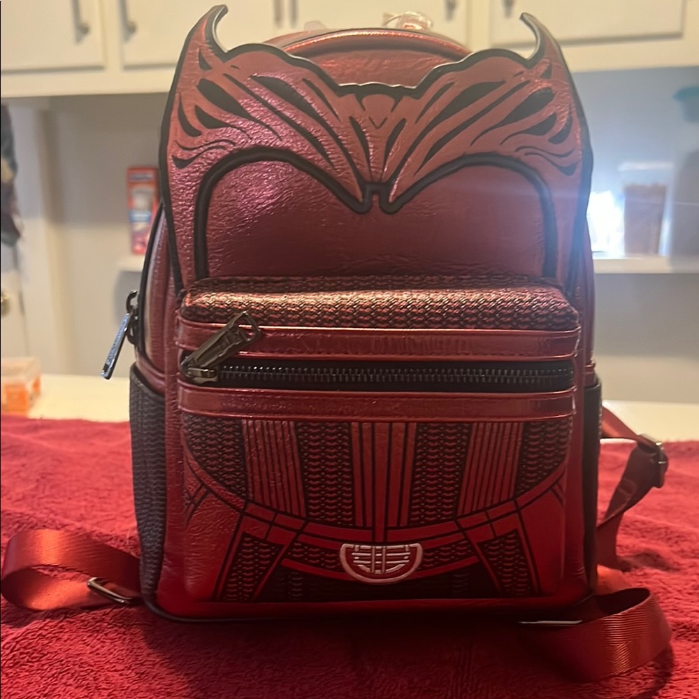 Red Loungefly Marvel Backpack with Intricate Black Detailing and Compact Design